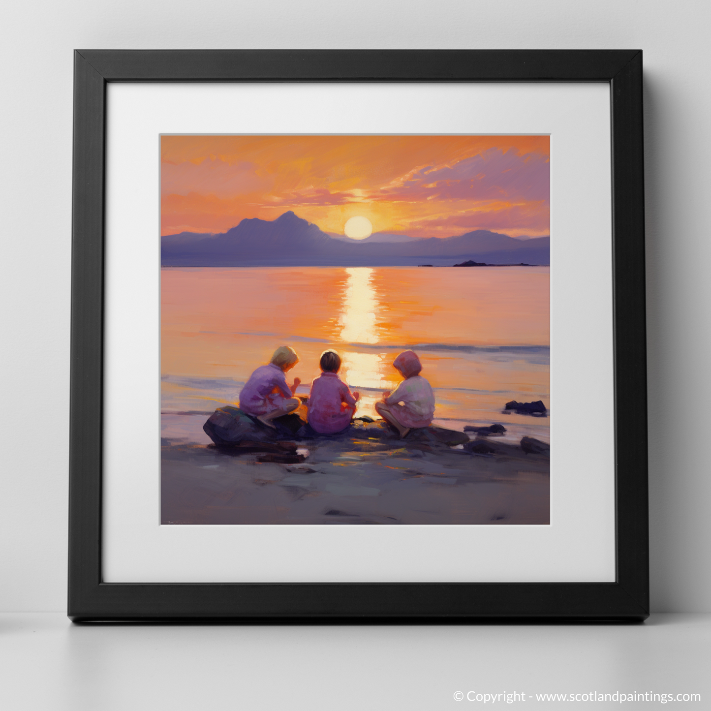 Art Print of Young explorers watching the sunset over the Isle of Arran from the peaceful Saltcoats Beach with a black frame