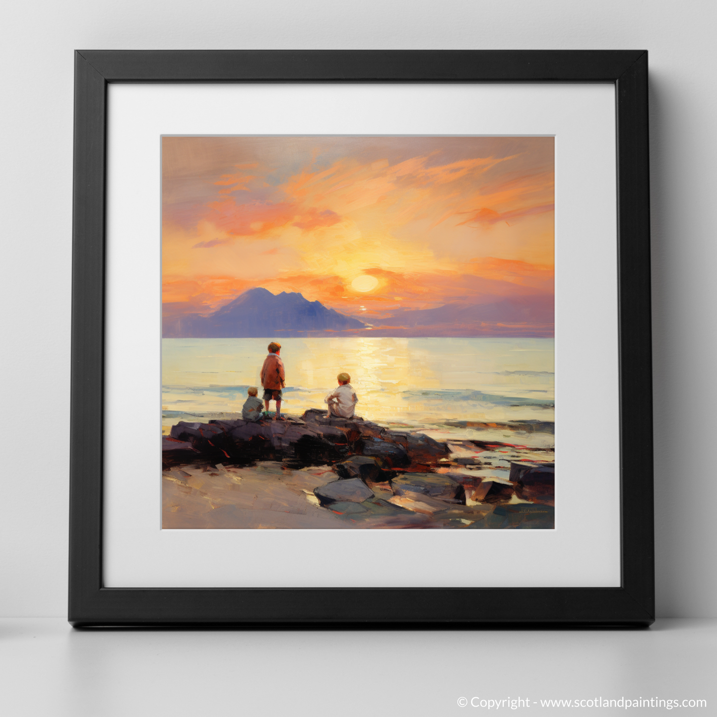 Art Print of Young explorers watching the sunset over the Isle of Arran from the peaceful Saltcoats Beach with a black frame